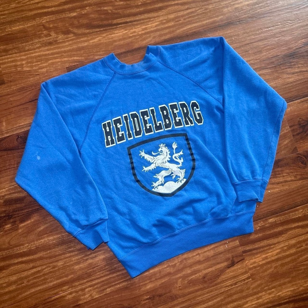 Blue vintage Heidelberg crewneck sweatshirt with white lion graphic